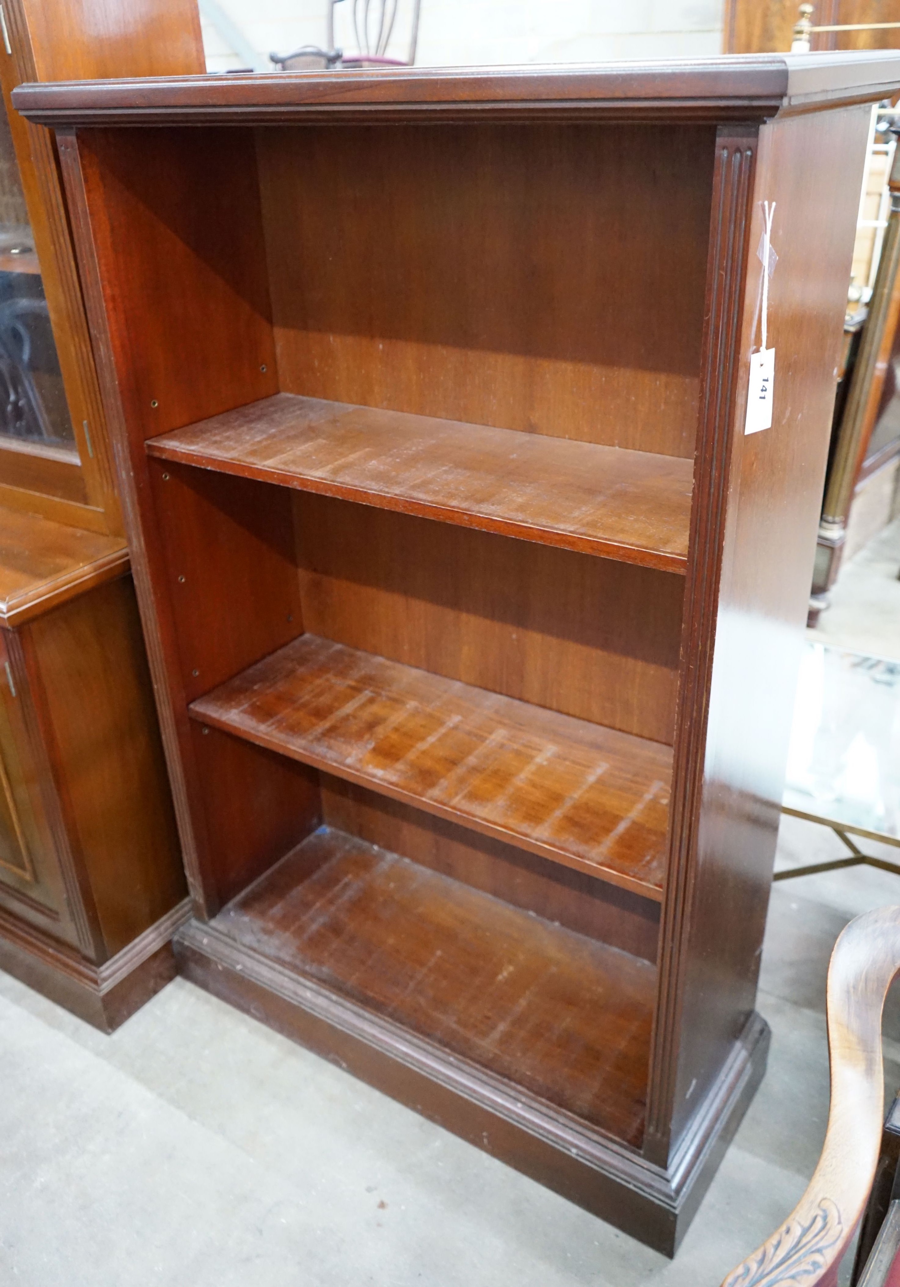A reproduction mahogany open bookcase, width 90cm, depth 34cm, height 137cm